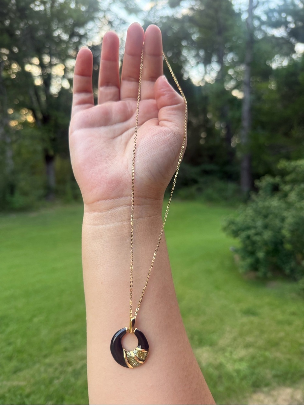 Gold Chain Necklace with Black Circular Pendant and Gold Accent